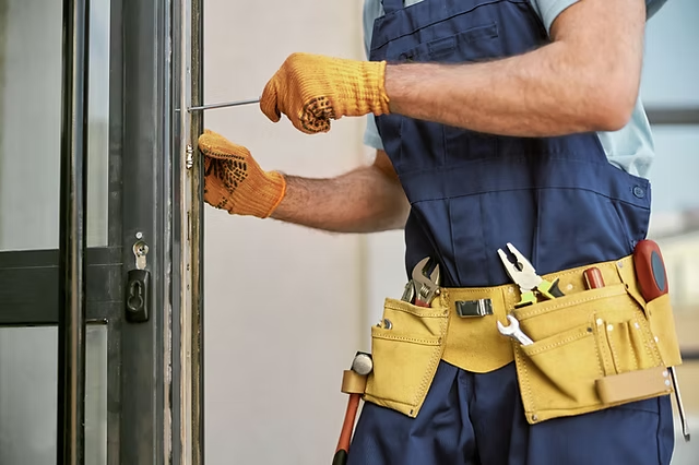 Technician performing door repair