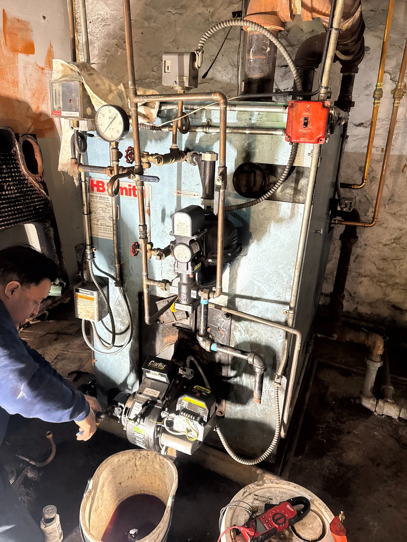 Technician servicing commercial boiler equipment
